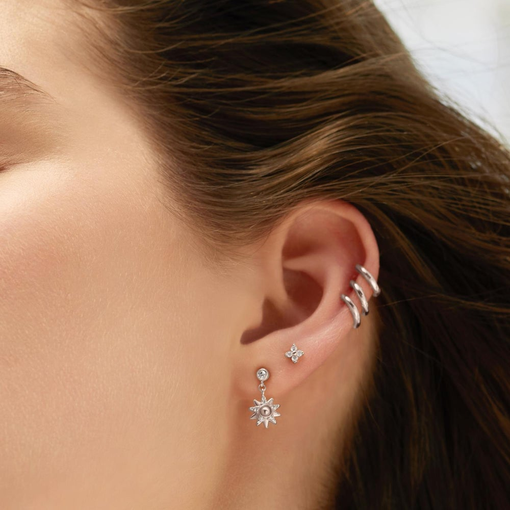 Starlit Drops Silver Sunburst Dangle Stud Earrings