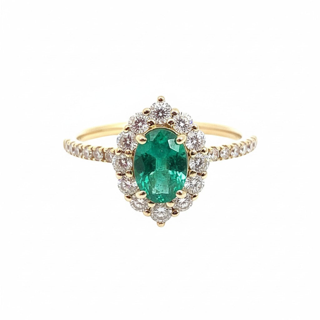 Selman's Jewelers 14k yellow gold oval emerald and diamond halo ring with 0.59ctw diamonds. May birthstone.