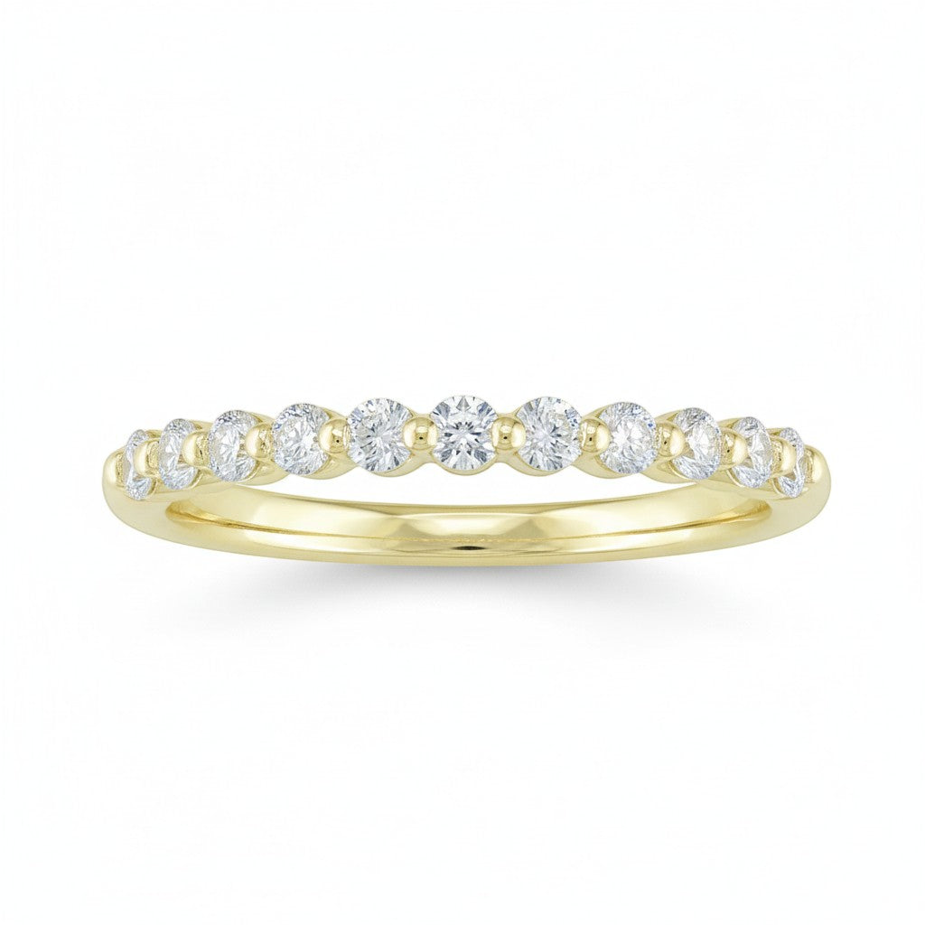 Selman's Jewelers 14k yellow gold shared prong diamond wedding band with 0.34ctw diamonds.