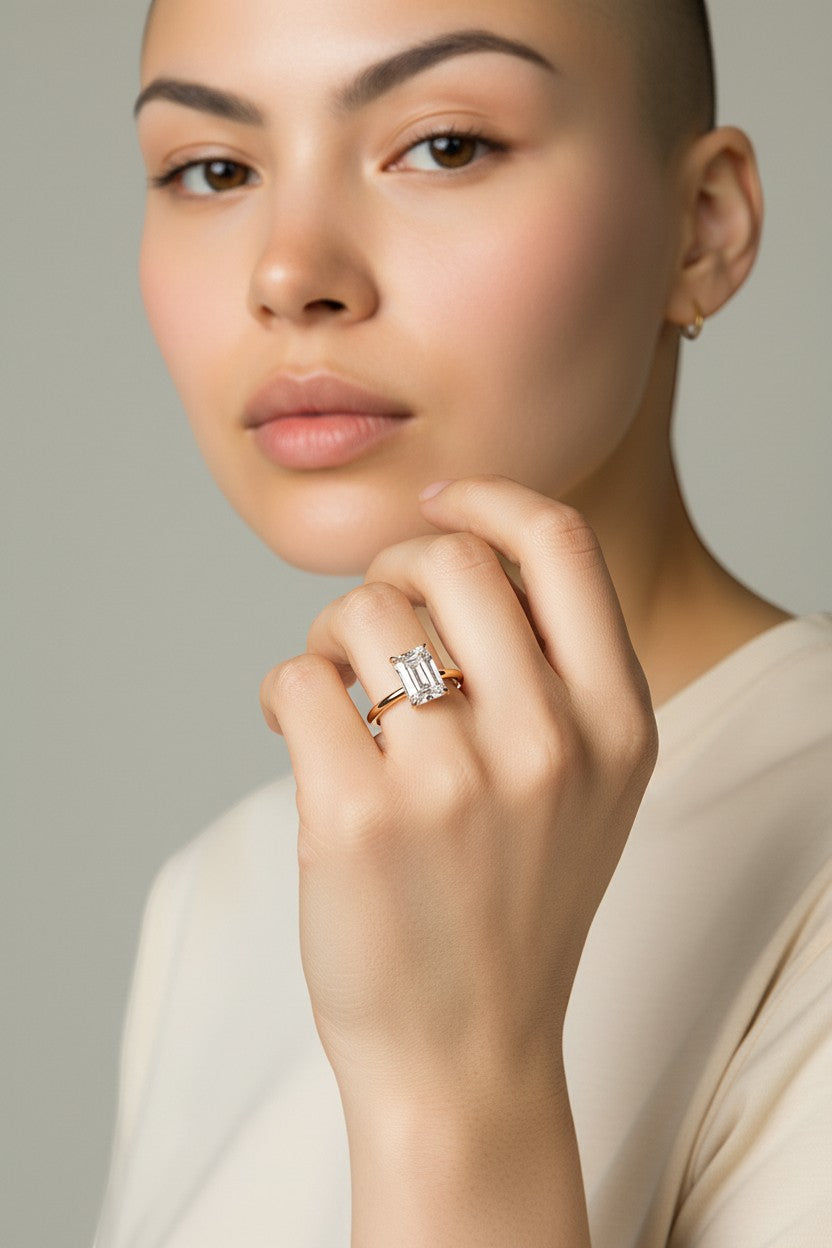 Selman's Jewelers 14k yellow gold engagement ring with 2.13ct emerald cut lab grown diamond and hidden halo.