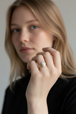 Selman's Jewelers 14k yellow gold solitaire engagement ring with a 2.03ct emerald-cut lab-grown diamond.