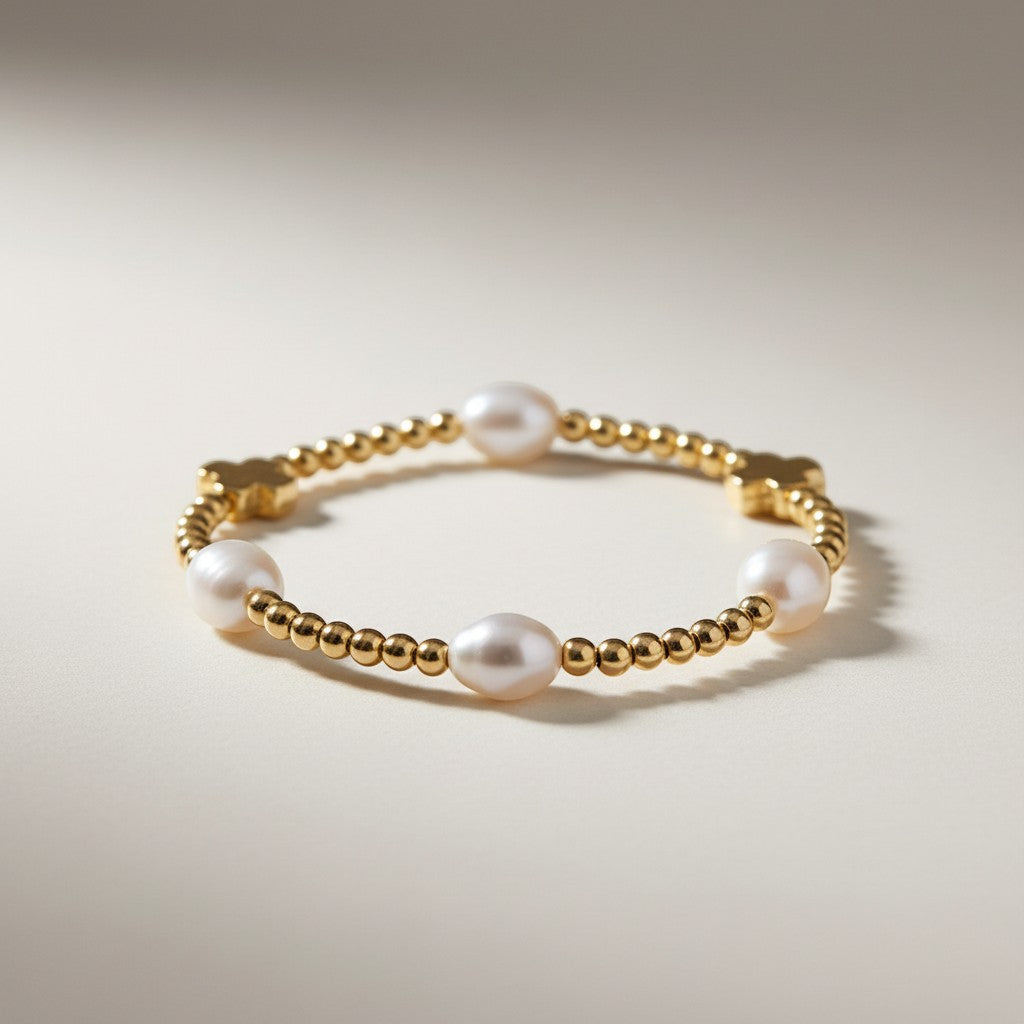 Selman’s Jewelers 14k gold filled bracelet with pearls and cross charms.