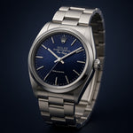 Selman’s Jewelers 1991 Rolex Air King Ref. 14000 stainless steel automatic watch with blue stick dial.