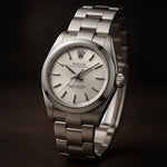 Selman's Jewelers pre-owned Rolex 26mm Datejust watch with silver dial and stainless steel Oyster bracelet. Reference 