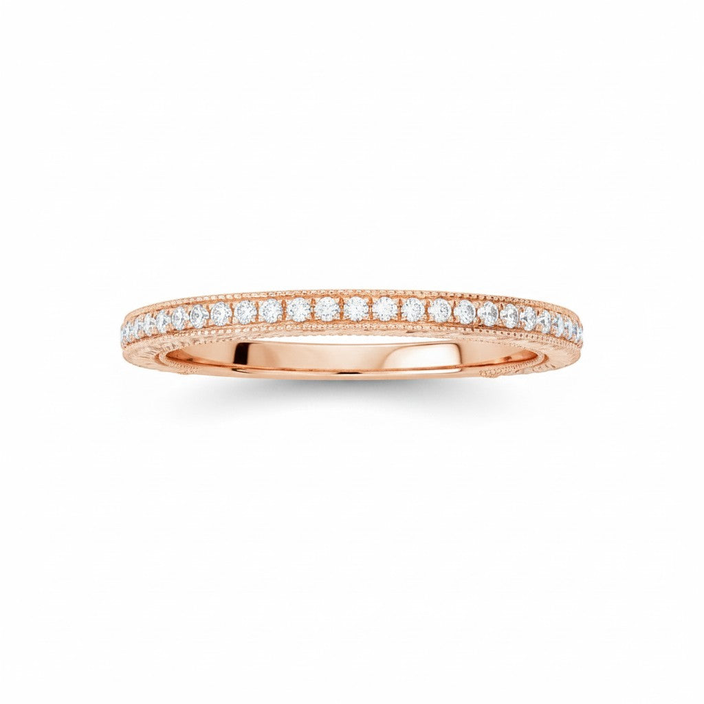Selman's Jewelers 14k rose gold stackable band with 0.15ctw diamonds and etched sides.
