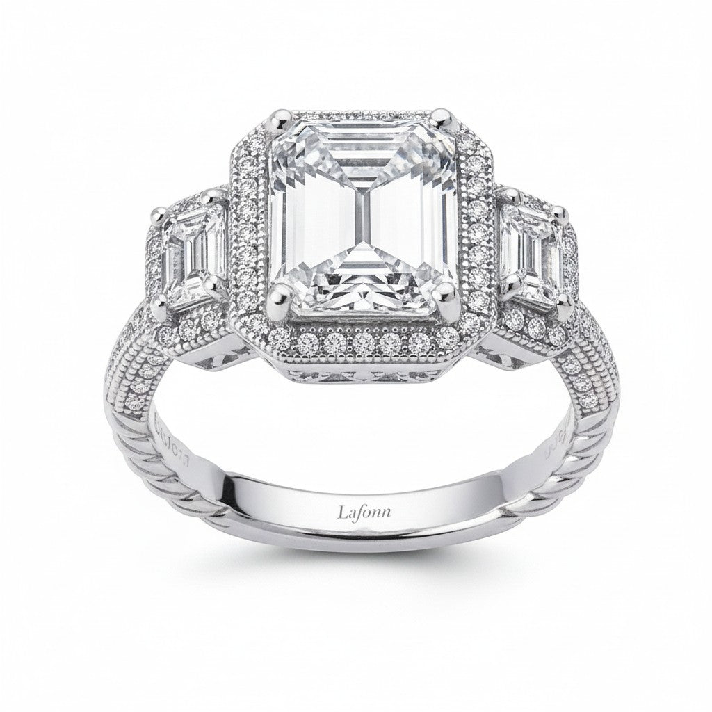 Selman's Jewelers three-stone emerald-cut diamond anniversary ring with pave halo and twisted band.
